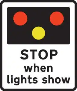 light signals ahead road sign