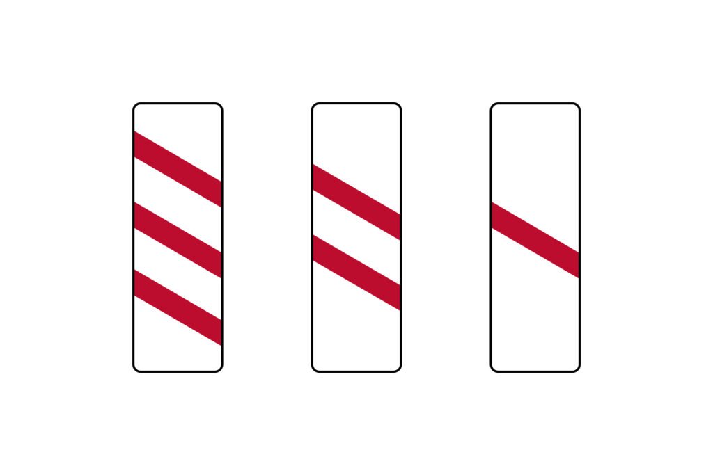 red and white countdown markers are found on approach to level crossings