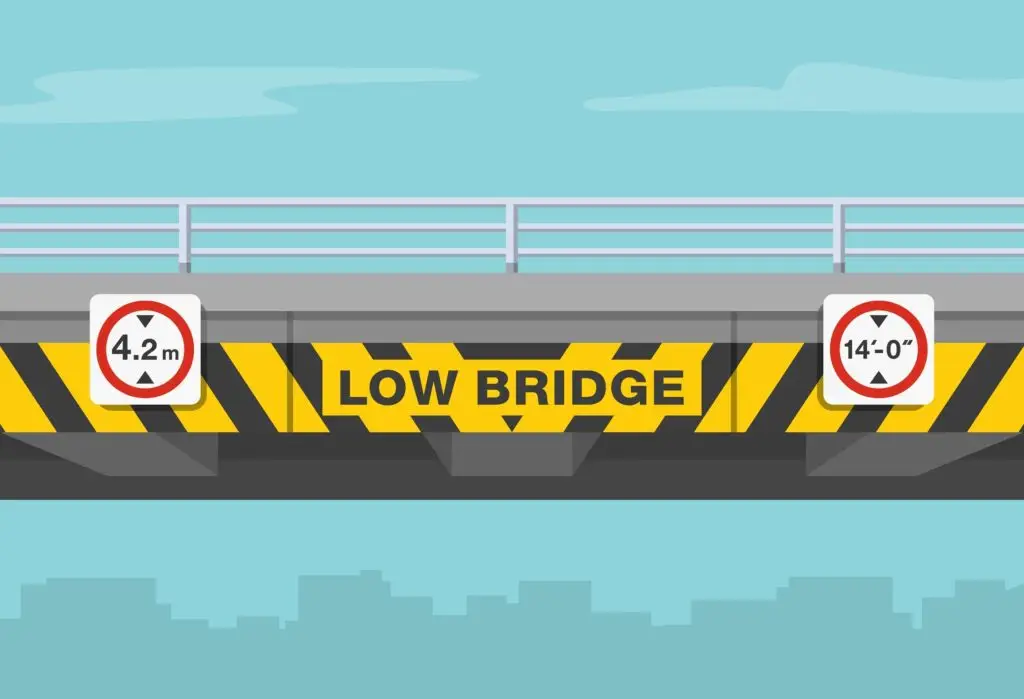 Close-upOfALowBridgeWithObstructionAndHazardMarker - Driver Training Theory Test Maximum Height vs Maximum Width: What’s the Difference?